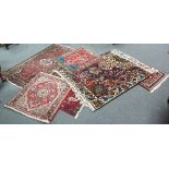 Six small modern Oriental style rugs of various sizes