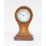 An Edwardian balloon mantel clock with Parisian dial and four paterae inlaid mahogany case