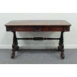 A William IV mahogany two-drawer table on carved end supports joined by a pole stretcher, 122cm