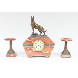 An Art Deco clock and garniture with spelter German shepherd, 38cm high to top of clock and tazza