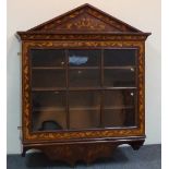 A Dutch marquetry on walnut floral inlaid wall cabinet with broken arch pediment and glazed door,