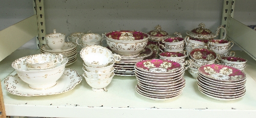 A Rockingham style part tea service, decorated gilded sprays on a puce ground and another part tea