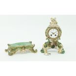 A French porcelain clock case, mid 19th Century, of scrolling foliate outline highlighted in gilt