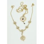 An Edwardian 15ct gold pendant necklace, the chain interspersed by five seed pearl flowerheads and