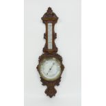 An aneroid barometer and thermometer,