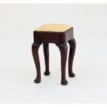 A small George II 18th Century walnut stool with square drop-in seat, on scroll carved cabriole legs