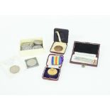 Ninteen crown coins, two medals and a boxed set of four sterling silver bridge pencils Condition