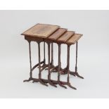 A nest of four George III style mahogany tables, circa 1810, the rectangular tops cross-banded and