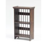 An oak plate rack with dowell divisions,