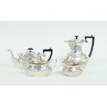 A silver four-piece tea and coffee service, J&C, Birminham 1904/1905, of oval half ribbed form,