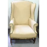 A George III style mahogany wing armchair,