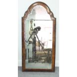 A 18th Century walnut mirror with shaped cresting to a bolection moulded frame with two-part