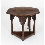 A fine early 17th Century burr oak credence table, the folding octagonal top upon an arcaded