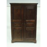 An early 18th Century oak cupboard with two doors,