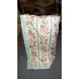 A pair of pink rose printed chintz curtains, 228cm drop, lined with tie-backs and a pelmet,