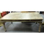 An Indian teak table, with five plank studded top on turned legs,