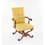 A George I 18th Century walnut and parcel gilt armchair in the manner of William Kent, the padded