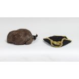 A child's 18th/19th Century tricorn hat with a gilt braid and a child's 18th/19th Century wig with