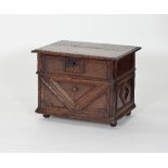 A 17th Century chestnut writing box with hinged lid above a fall front applied with geometric