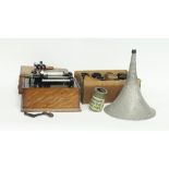 A phonograph with horn in an oak case and a box of cylinders for the same Condition Report: The