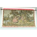 A machine woven tapestry depicting courting couples by a fountain in an Italian landscape,