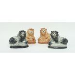 Two pairs of Staffordshire pottery style recumbent lions,