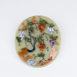 An oval onyx plaque applied fruits and foliage in semi precious stones with squirrels scattered