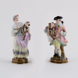 A pair of German porcelain figural scent bottles, late 19th Century, modelled as a maiden and