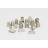 A collection of silver thimbles, one with band of enamelled decoration and three silver buttons,