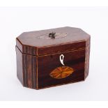 A George III mahogany rectangular tea caddy with ring handles and batswing patera to the cover,