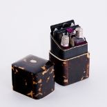 A Regency tortoiseshell necessaire with ivory banding, fitted scissors, mirror, note pad,