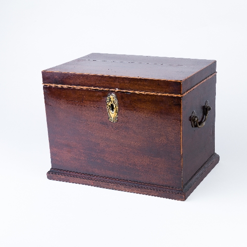 A mahogany cigar box with hinged cover, brass escutcheon plate and handles to the sides,
