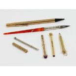 A silver mounted cornelian pen, a 9ct gold cased propelling pencil,