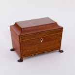A Regency rosewood sarcophagus shaped tea caddy, the cover and front cross banded,