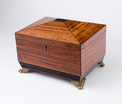 A Regency satinwood rectangular sewing box, with hinged cover on four gilt brass claw feet,