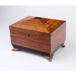 A Regency satinwood rectangular sewing box, with hinged cover on four gilt brass claw feet,