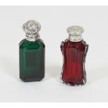 A green glass scent bottle with scroll embossed white metal cover,