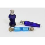 A pale blue glass double ended scent bottle, with floral embossed mounts,