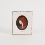 Late 19th Century French School/Portrait of a Lady in Red/oval watercolour on ivory, 8cm x 6.