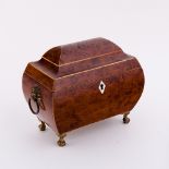 A Regency yew wood sarcophagus shaped tea caddy,