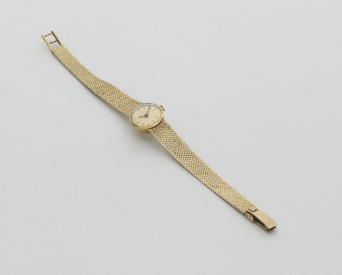 A lady's 9ct gold cased wristwatch, the circular dial signed Eterna, the case numbered 6184395, on