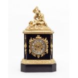 A French black marble and ormolu mantel clock, the eight-day movement striking on a bell,