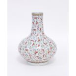 A large Chinese famille rose bottle vase, painted with bats, 34cm high Condition Report: Vase with