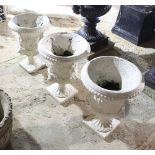 Three reconstituted stone campana shaped vases,