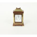 A late 19th Century mahogany brass mounted eight-day carriage clock, the case with bell top and