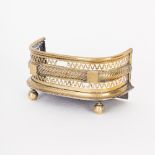 A Victorian dolls house brass fender, pierced and with rope band to the centre, on ball feet,