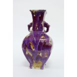 A Chinese sang-de-boeuf square baluster two-handled vase, apocryphal impressed mark beneath, 31cm