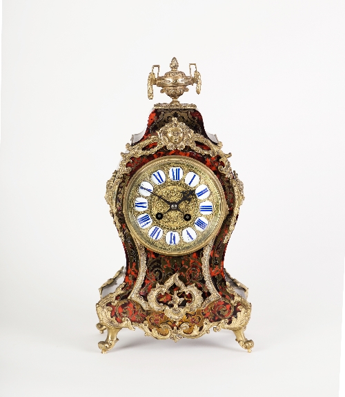 A 19th Century tortoiseshell and brass boulle type eight-day mantel clock, the case with gilt