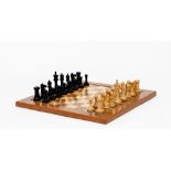 A Jaques Staunton boxwood and ebony chess set, the two rooks and two knights with mitre stamp, the