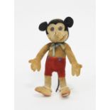 A Dean's Rag Book Mickey Mouse figure, wearing red shorts,